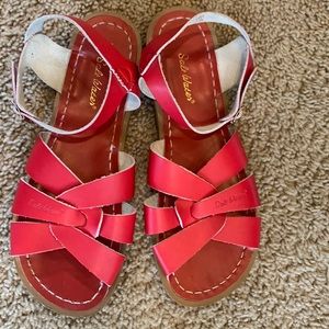 Salt water. The bottom of the sandal says 9,  but inside the strap it says W-11